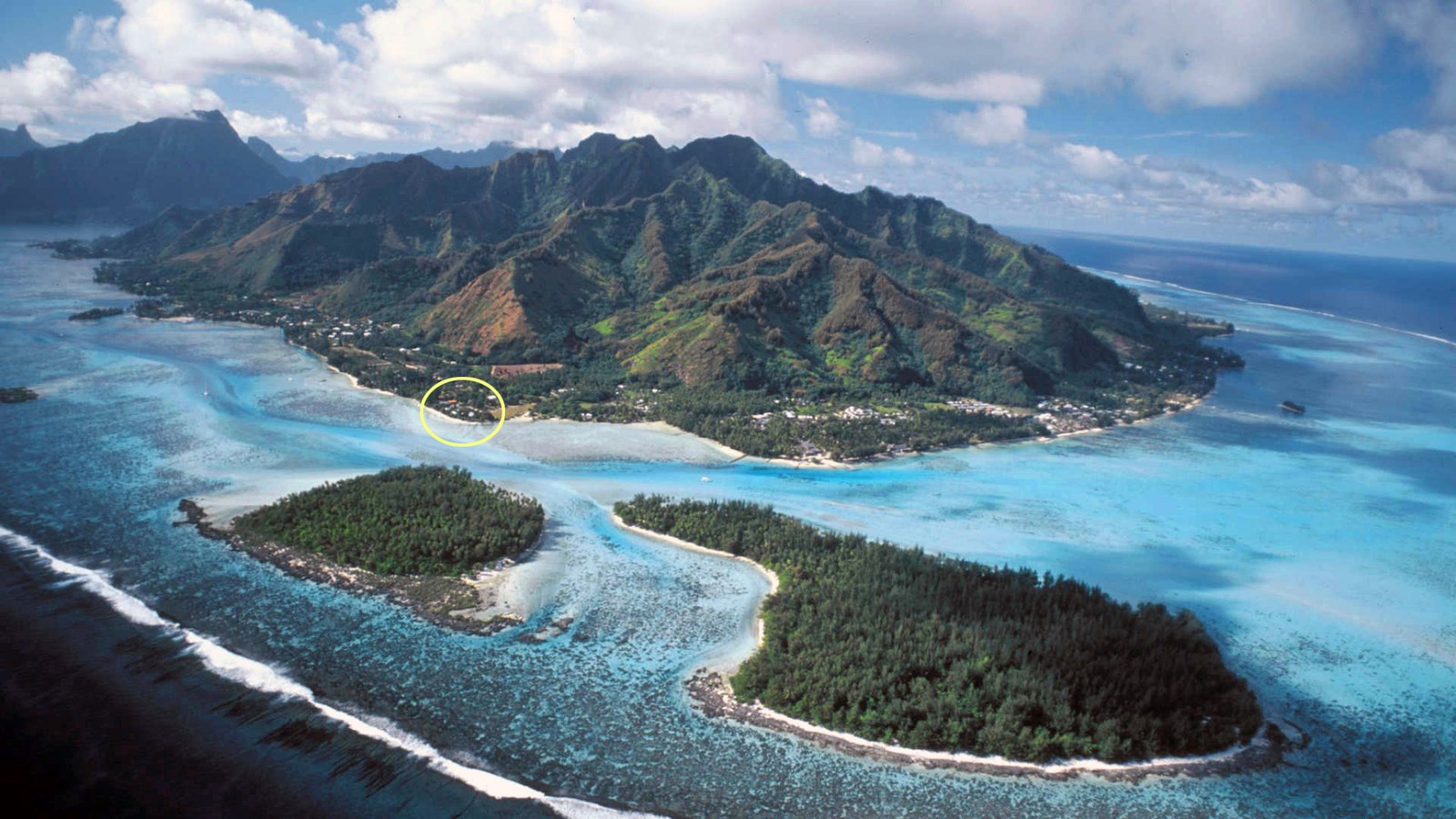 Aerial view of Mo'orea and Tahiti, with Kevin's location circled on the north shore