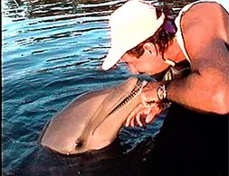 Kevin Keys with a dolphin, Florida Keys, 1990